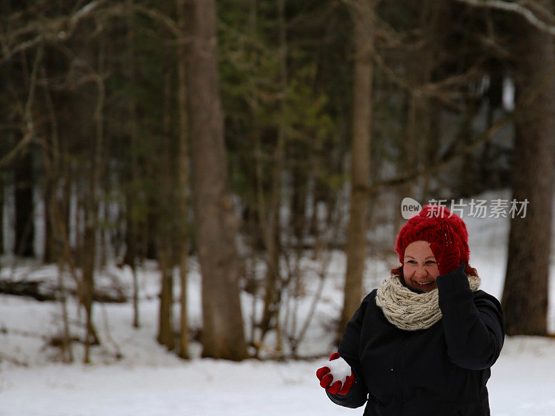 Woman Holding Snowball in Playing Snowball Fight